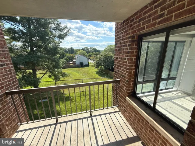 a view of balcony with wooden floor