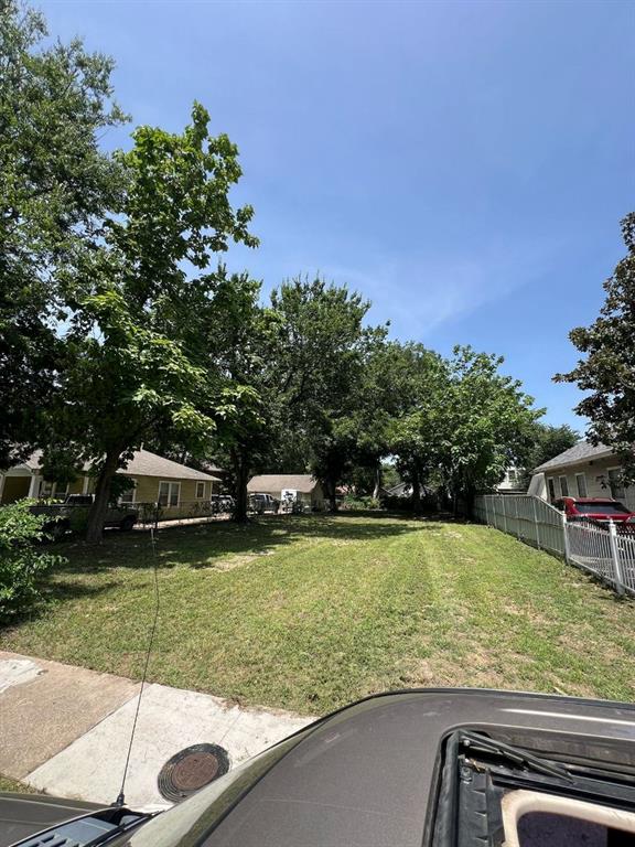 a view of a swimming pool with a yard