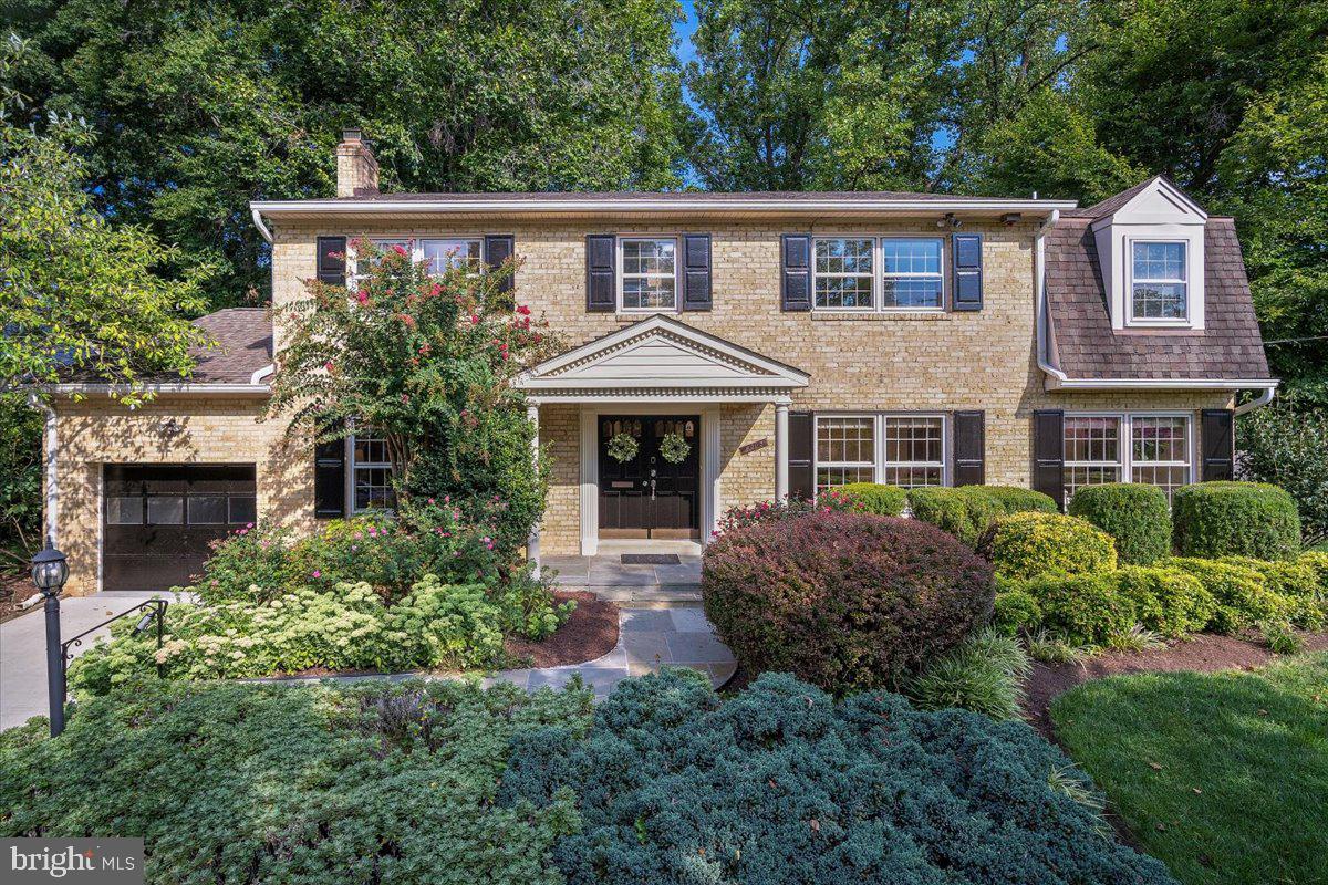 6305 Lenox Road Bethesda, MD 20817 - Photo 1 of 49 a front view of a house with a garden