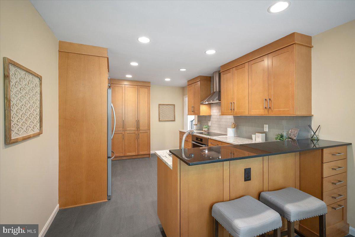 6305 Lenox Road Bethesda, MD 20817 - Photo 14 of 49 a kitchen that has a sink and a stove in it