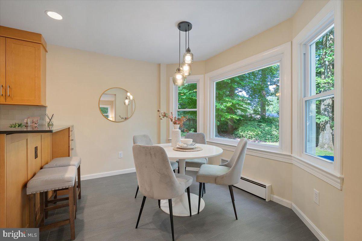 6305 Lenox Road Bethesda, MD 20817 - Photo 15 of 49 a view of a dining room with furniture window and outside view