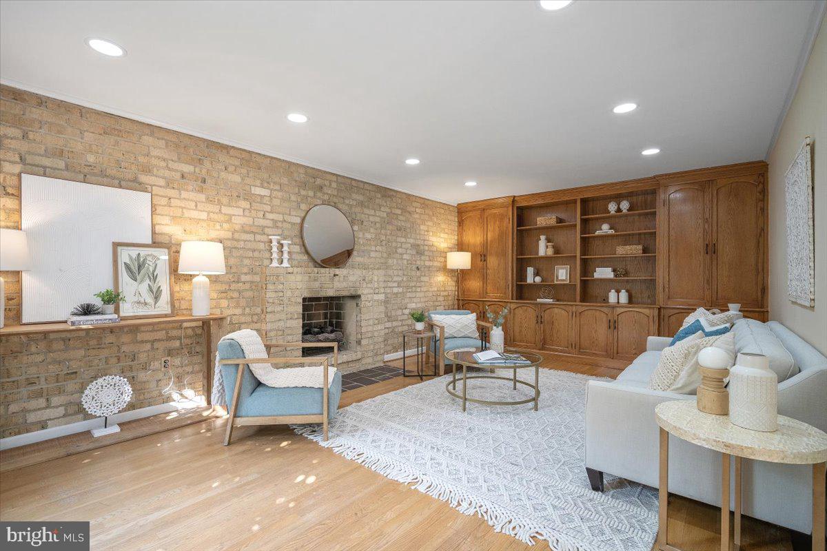 6305 Lenox Road Bethesda, MD 20817 - Photo 16 of 49 a living room with fireplace furniture and a wooden floor