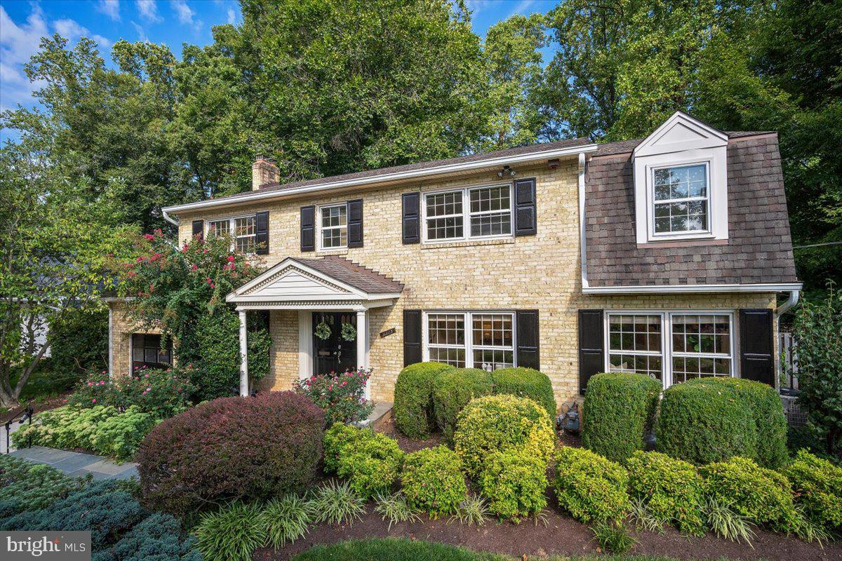 6305 Lenox Road Bethesda, MD 20817 - Photo 2 of 49 a front view of a house with yard and green space