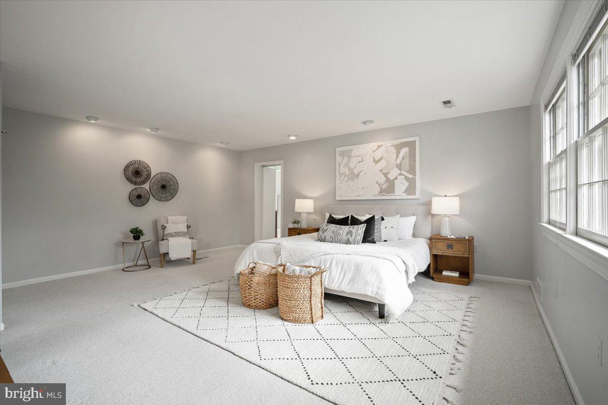 6305 Lenox Road Bethesda, MD 20817 - Photo 22 of 49 a bedroom with bed and a large window