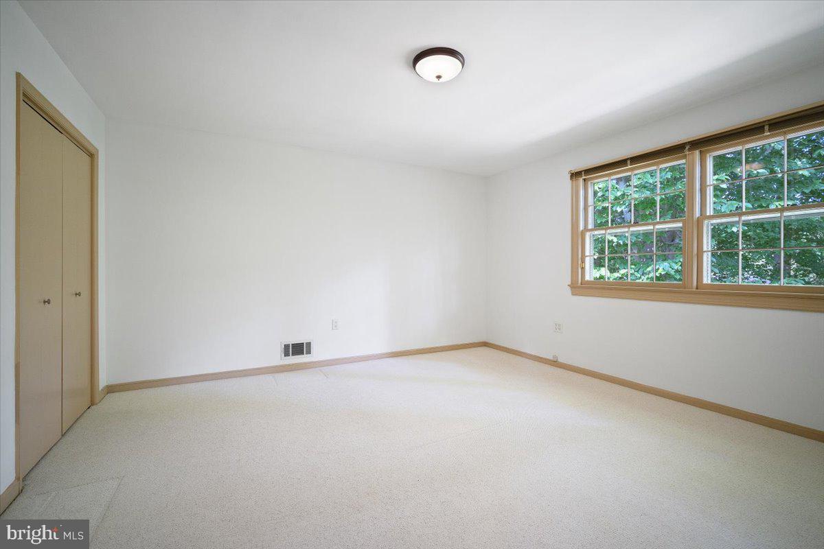 6305 Lenox Road Bethesda, MD 20817 - Photo 29 of 49 an empty room with a window