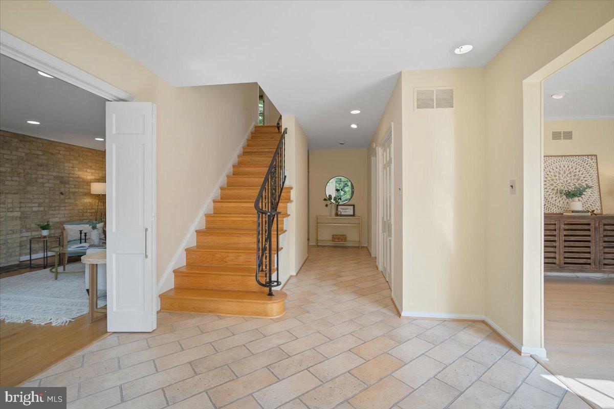 6305 Lenox Road Bethesda, MD 20817 - Photo 3 of 49 a view of entryway and hall with a couch