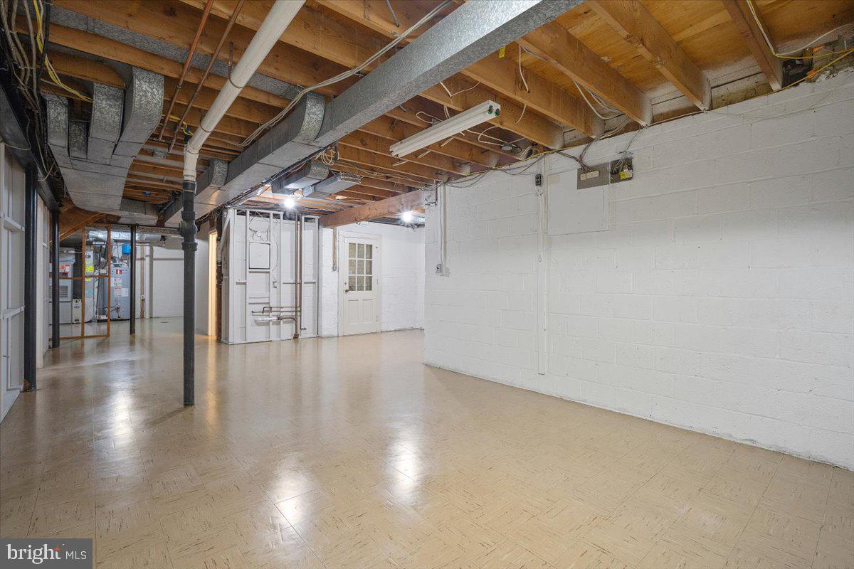 6305 Lenox Road Bethesda, MD 20817 - Photo 41 of 49 a view of a room with wooden floors