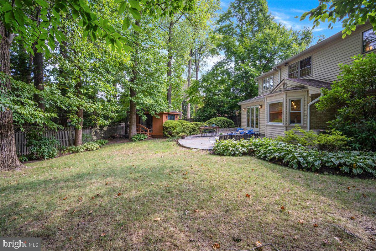 6305 Lenox Road Bethesda, MD 20817 - Photo 45 of 49 a view of a house with a backyard and a tree