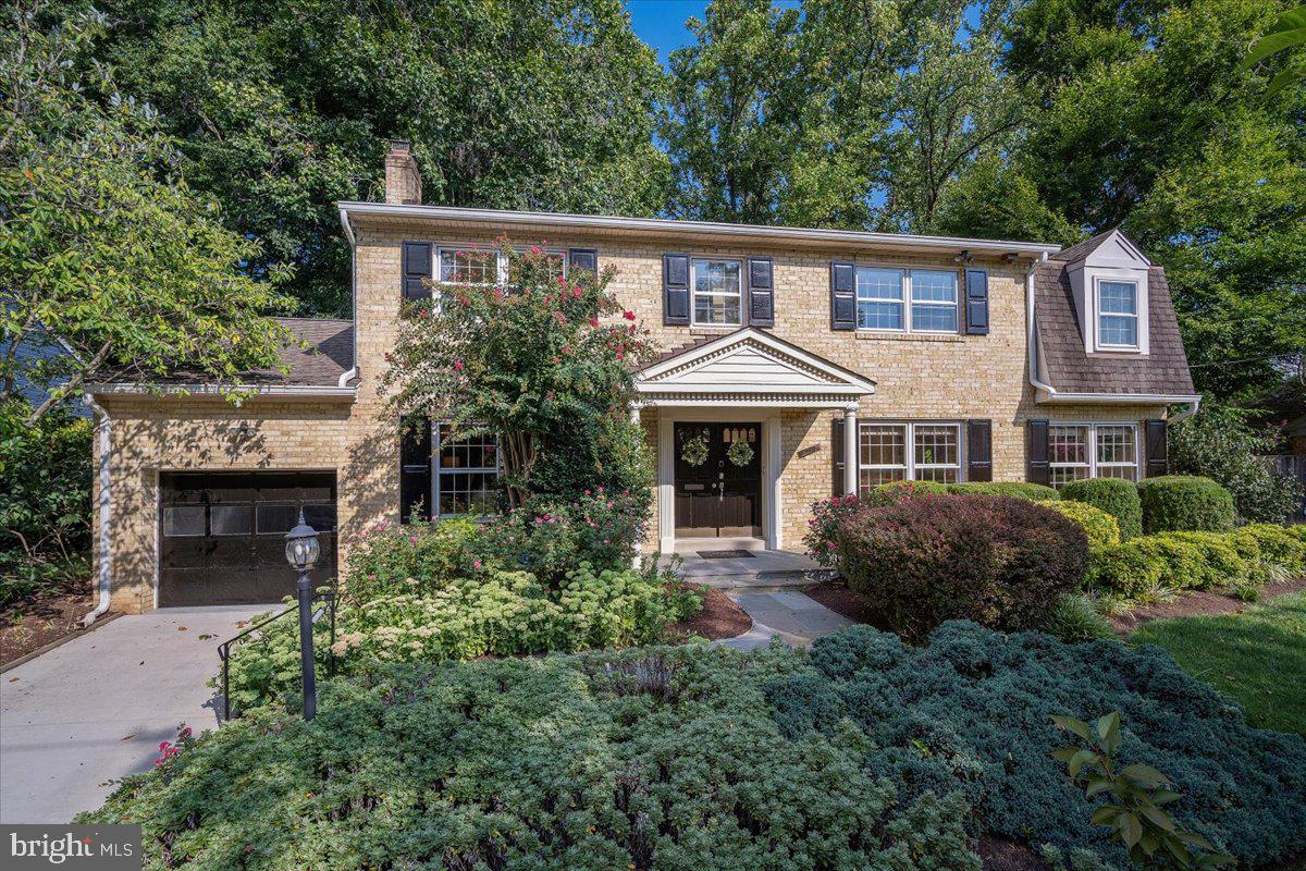 6305 Lenox Road Bethesda, MD 20817 - Photo 47 of 49 a front view of a house with a garden
