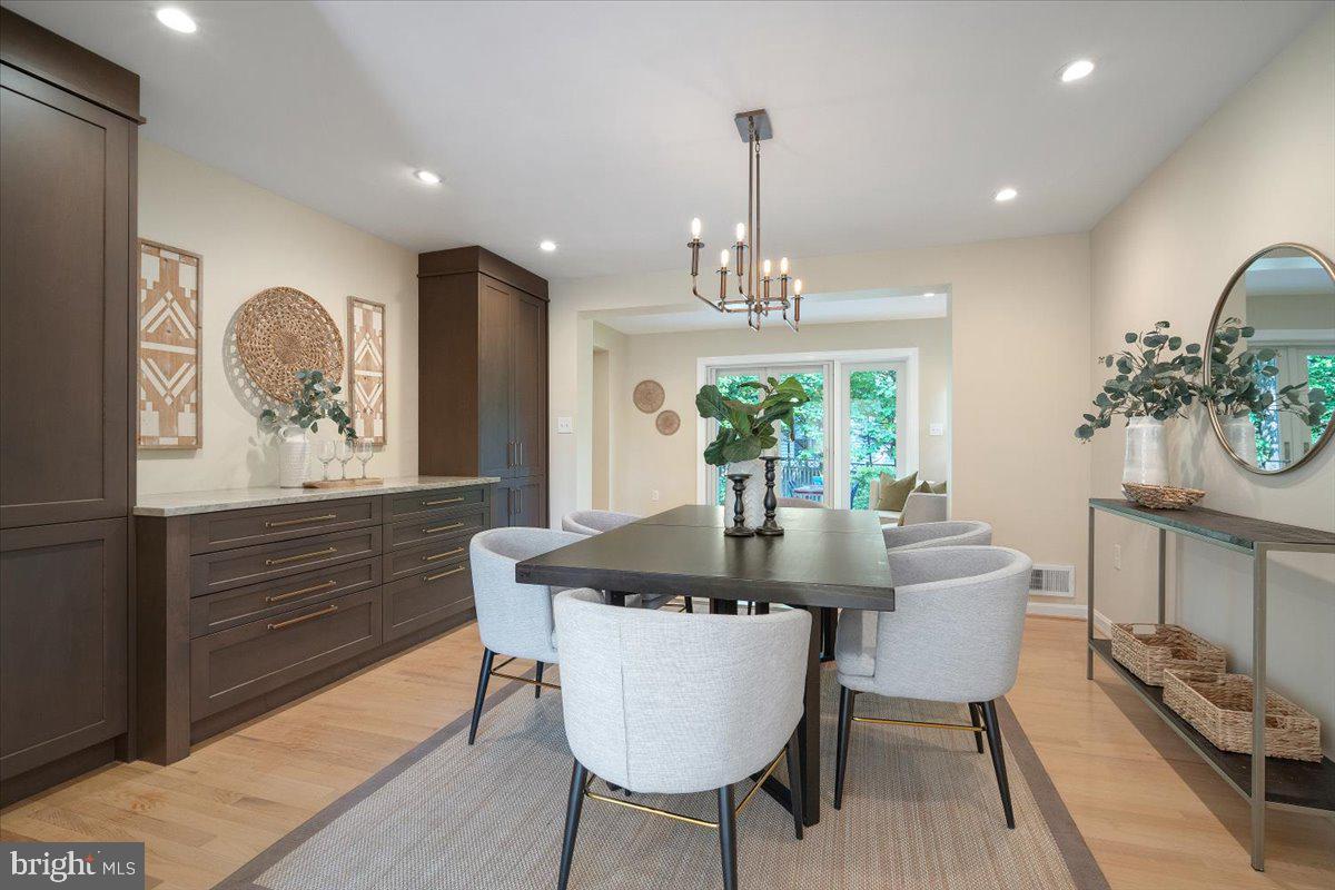 6305 Lenox Road Bethesda, MD 20817 - Photo 8 of 49 a view of a dining room with furniture window and wooden floor