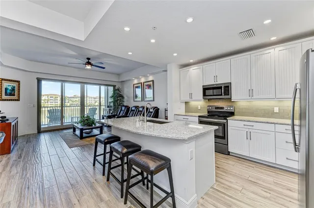 a kitchen with a refrigerator and a sink