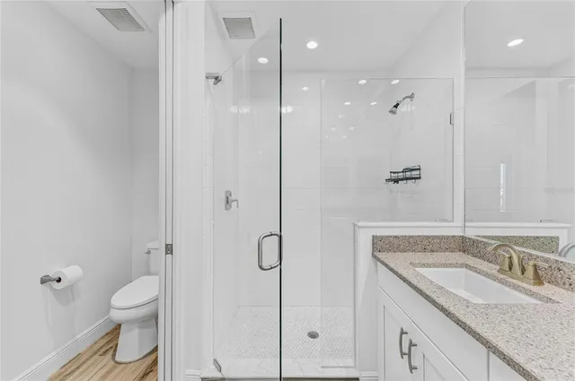 a view of a two chairs in the balcony