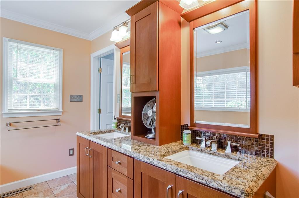 7607 Strawberry Road Summerfield, NC 27358 - Photo 20 of 30 New cabinets with granite counter tops and 2 sinks. Great place to get ready for your day!