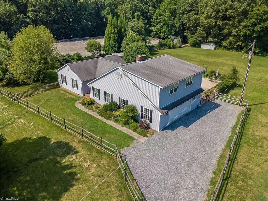 7607 Strawberry Road Summerfield, NC 27358 - Photo 3 of 30 Yard and pastures are fully fenced. No HOA!