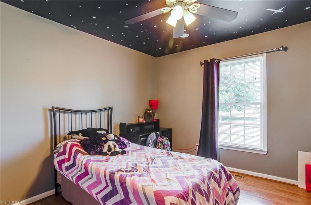 7607 Strawberry Road Summerfield, NC 27358 - Photo 21 of 30 Bedroom or could be used as office or flex room. The decorative ceiling glows in the dark!