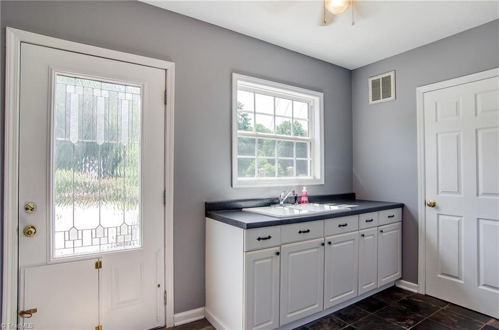 7607 Strawberry Road Summerfield, NC 27358 - Photo 24 of 30 Mud room has great storage and is accessed easily from the pool area or the garage.