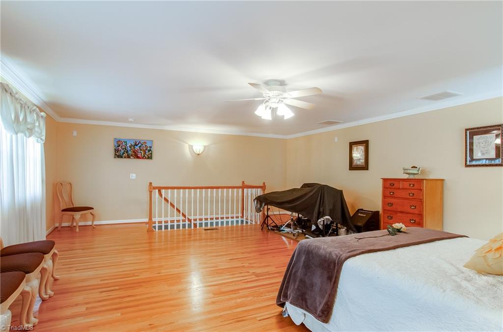 7607 Strawberry Road Summerfield, NC 27358 - Photo 26 of 30 Upstairs this room is used as an additional master suite. Could be used as a wonderful quest suite or recreation room.