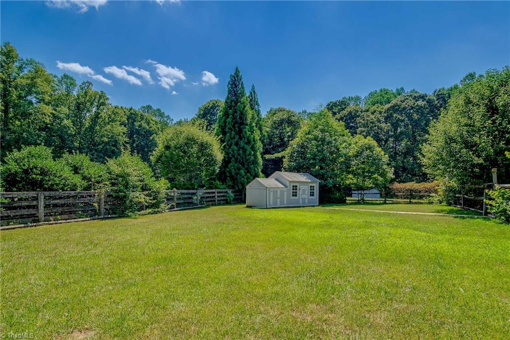 7607 Strawberry Road Summerfield, NC 27358 - Photo 5 of 30 Darling playhouse or ideal gardening shed. Area to the left is great storage for toys or tools.