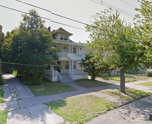 a view of a house with a yard