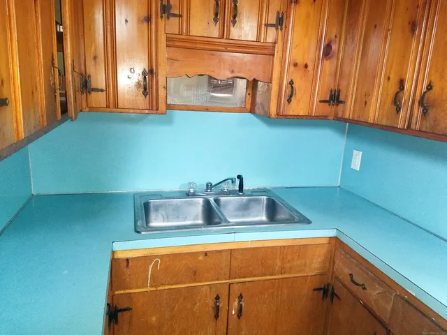 a kitchen with stainless steel appliances a sink and a microwave