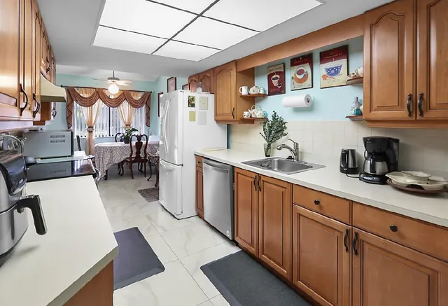 a dining room with furniture and window in it