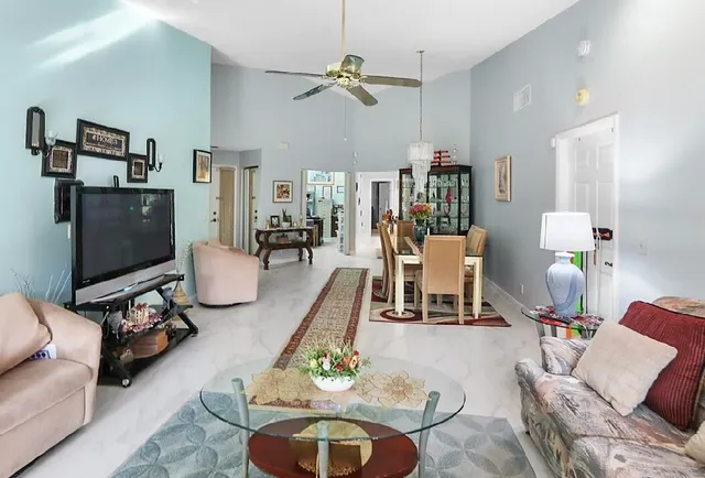 a work room with furniture and a flat screen tv