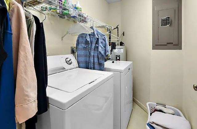 a bedroom with bed and wooden floor