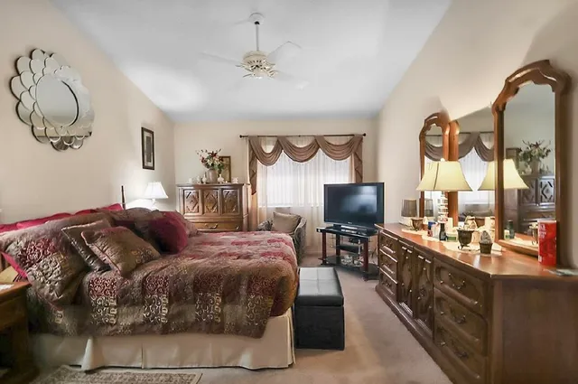 a kitchen with sink and mirror