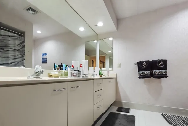 a view of a dining room with furniture wooden floor and chandelier