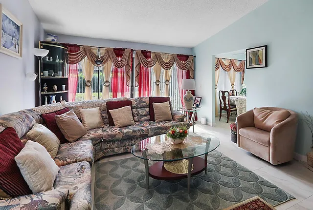 a view of a chairs and tables in a room