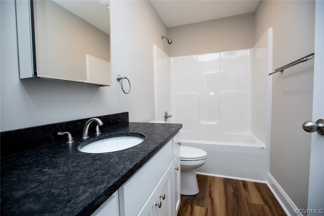 4086 Pin Oak Road Prospect, VA 23960 - Photo 29 of 44 a bathroom with a granite countertop sink a toilet and bathtub