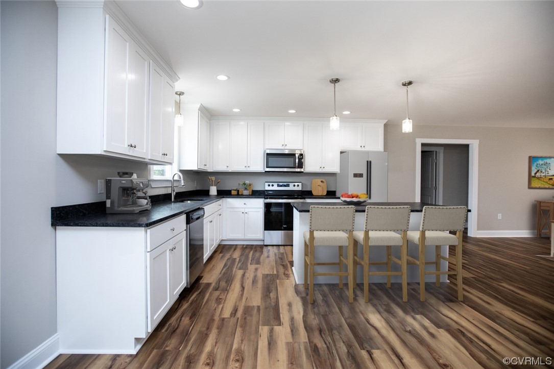 4086 Pin Oak Road Prospect, VA 23960 - Photo 6 of 44 a kitchen with granite countertop white cabinets and stainless steel appliances
