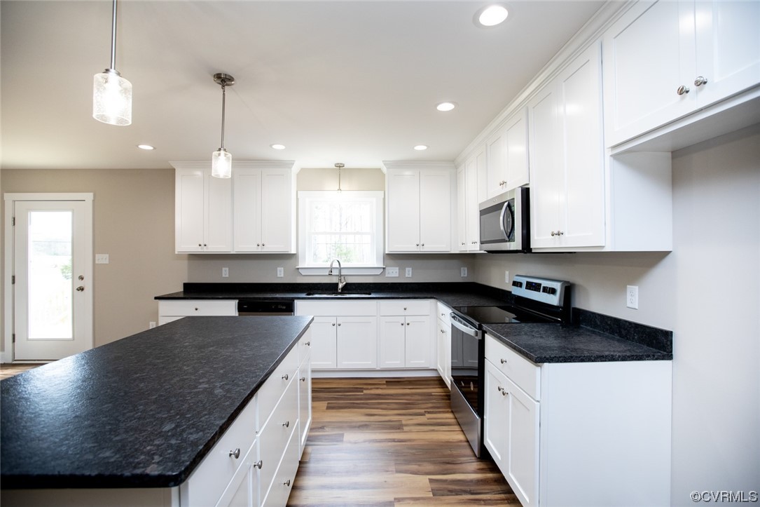 4086 Pin Oak Road Prospect, VA 23960 - Photo 10 of 44 a kitchen with granite countertop a sink a counter space appliances and cabinets