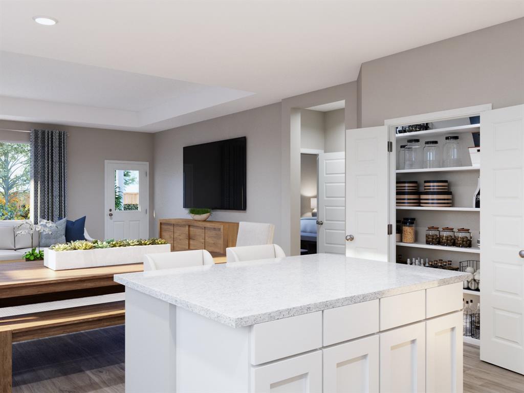 101 Manchester Drive Cleburne, TX 76031 - Photo 12 of 30 a room with a bed and a flat screen tv