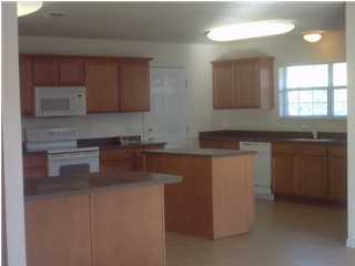 1346 Driftwood Point Road Santa Rosa Beach, FL 32459 - Photo 3 of 5 a kitchen with stainless steel appliances granite countertop a sink stove and cabinets