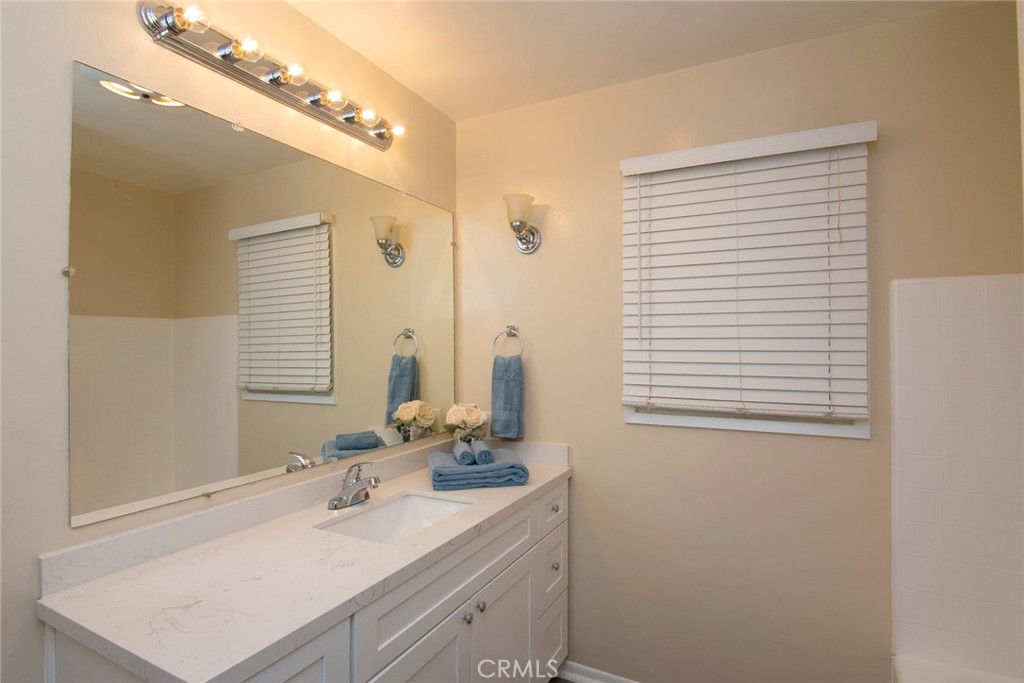 2983 Cheyenne Road Riverside, CA 92506 - Photo 22 of 49 a bathroom with a sink and a mirror