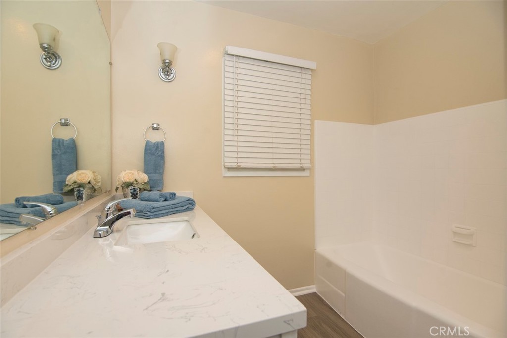 2983 Cheyenne Road Riverside, CA 92506 - Photo 24 of 49 a bathroom with a sink and a mirror