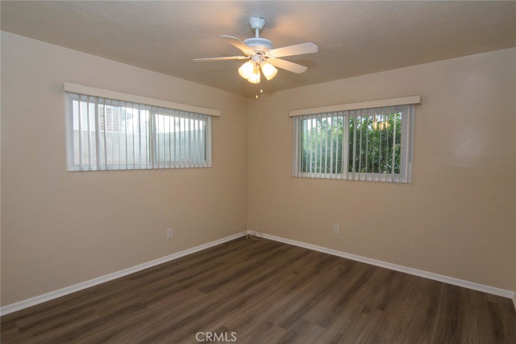 2983 Cheyenne Road Riverside, CA 92506 - Photo 26 of 49 a view of an empty room with wooden floor and a window