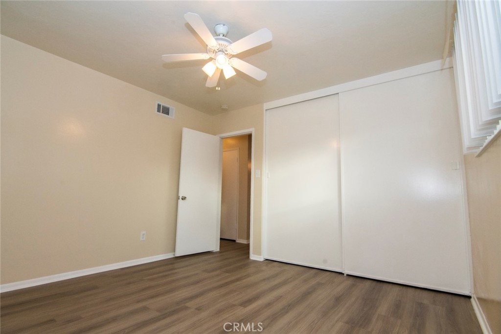 2983 Cheyenne Road Riverside, CA 92506 - Photo 28 of 49 an empty room with wooden floor and window