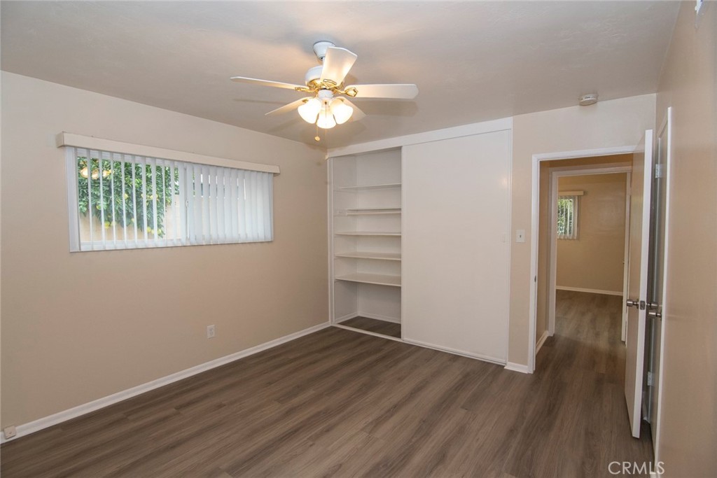 2983 Cheyenne Road Riverside, CA 92506 - Photo 32 of 49 a view of an empty room with wooden floor and a window