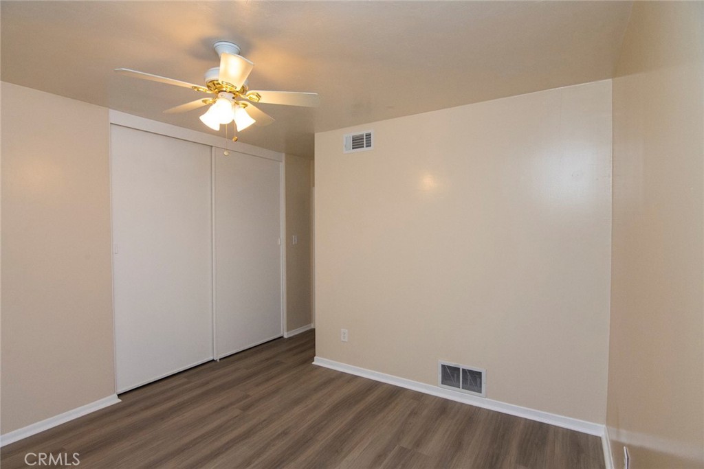 2983 Cheyenne Road Riverside, CA 92506 - Photo 6 of 49 a view of an empty room with wooden floor