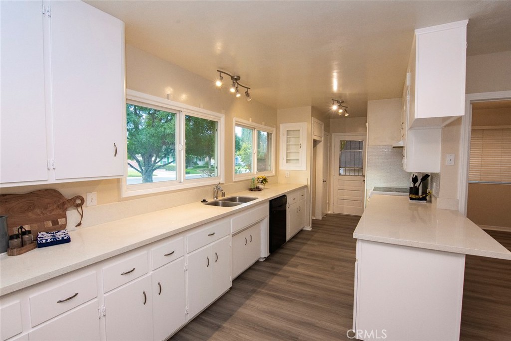 2983 Cheyenne Road Riverside, CA 92506 - Photo 8 of 49 a large kitchen with kitchen island a sink stainless steel appliances and cabinets