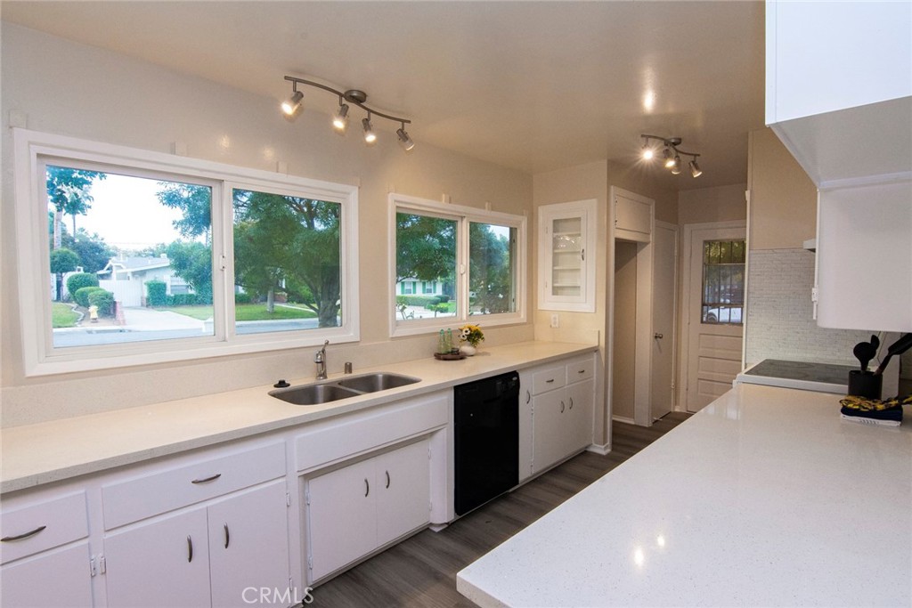 2983 Cheyenne Road Riverside, CA 92506 - Photo 10 of 49 a kitchen with a sink stove and cabinets