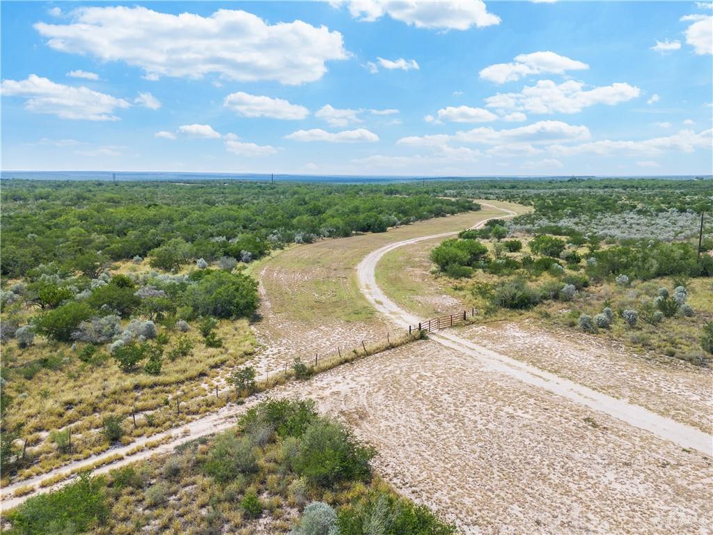 Tbdd Rio Vista Boulevard Rio Grande City, TX 78582 - Photo 6 of 18 a view of a dry yard with wooden fence