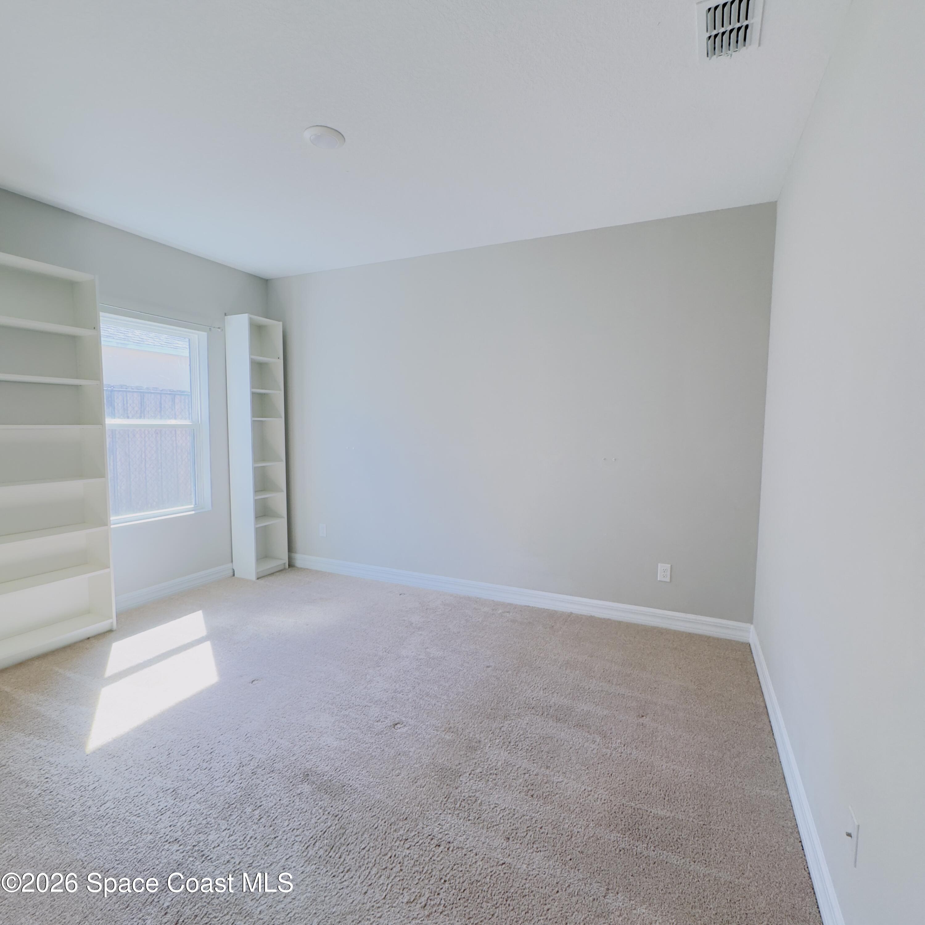 1376 Torgerson Road Southeast Palm Bay, FL 32909 - Photo 11 of 15 a view of room with walk in closet