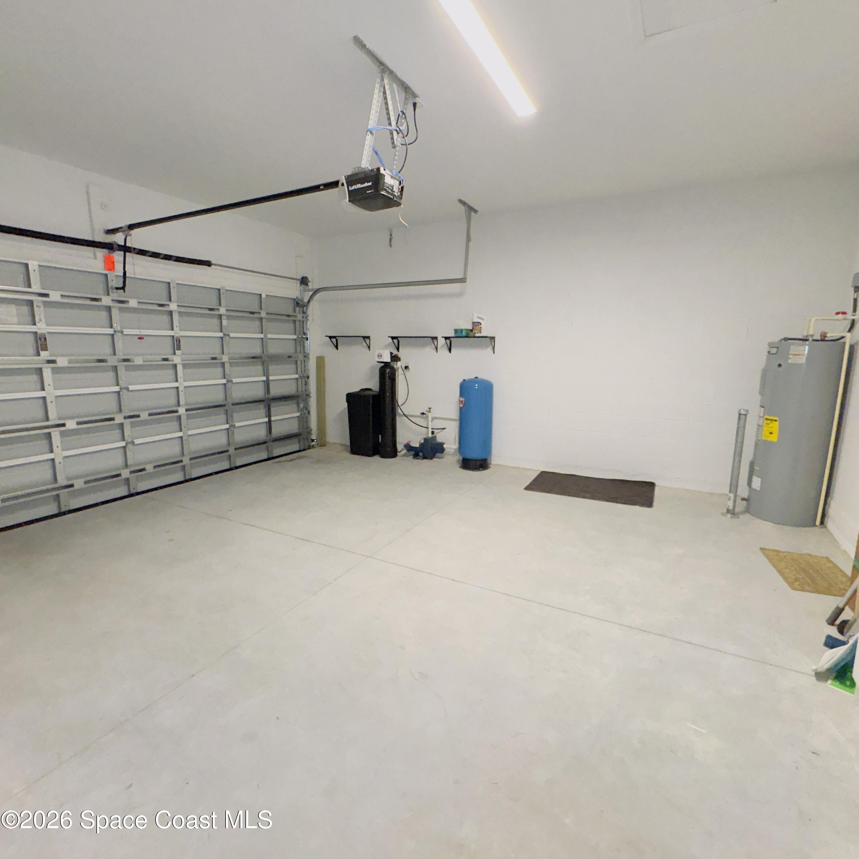 1376 Torgerson Road Southeast Palm Bay, FL 32909 - Photo 15 of 15 a view of a garage with storage