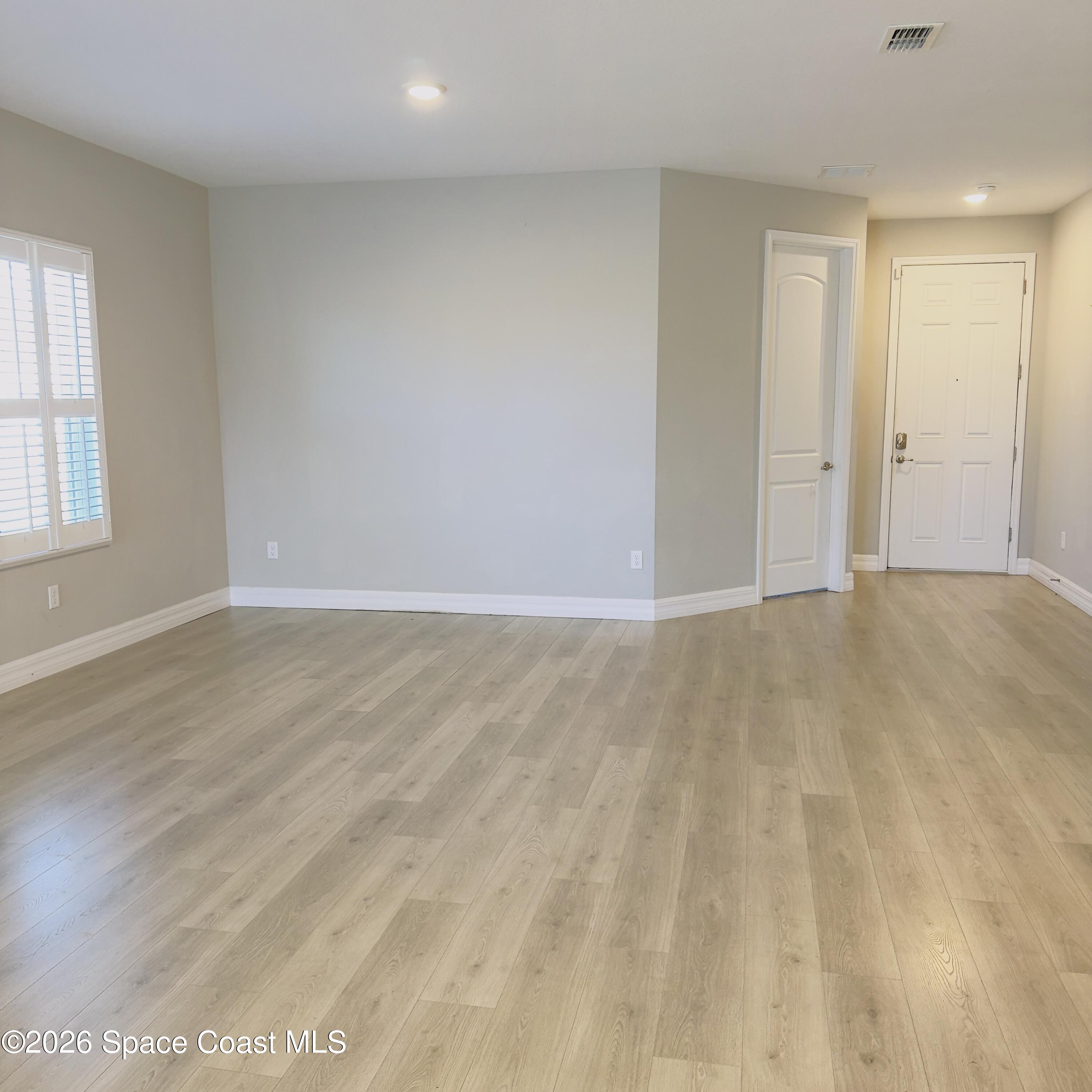 1376 Torgerson Road Southeast Palm Bay, FL 32909 - Photo 2 of 15 a view of an empty room and window