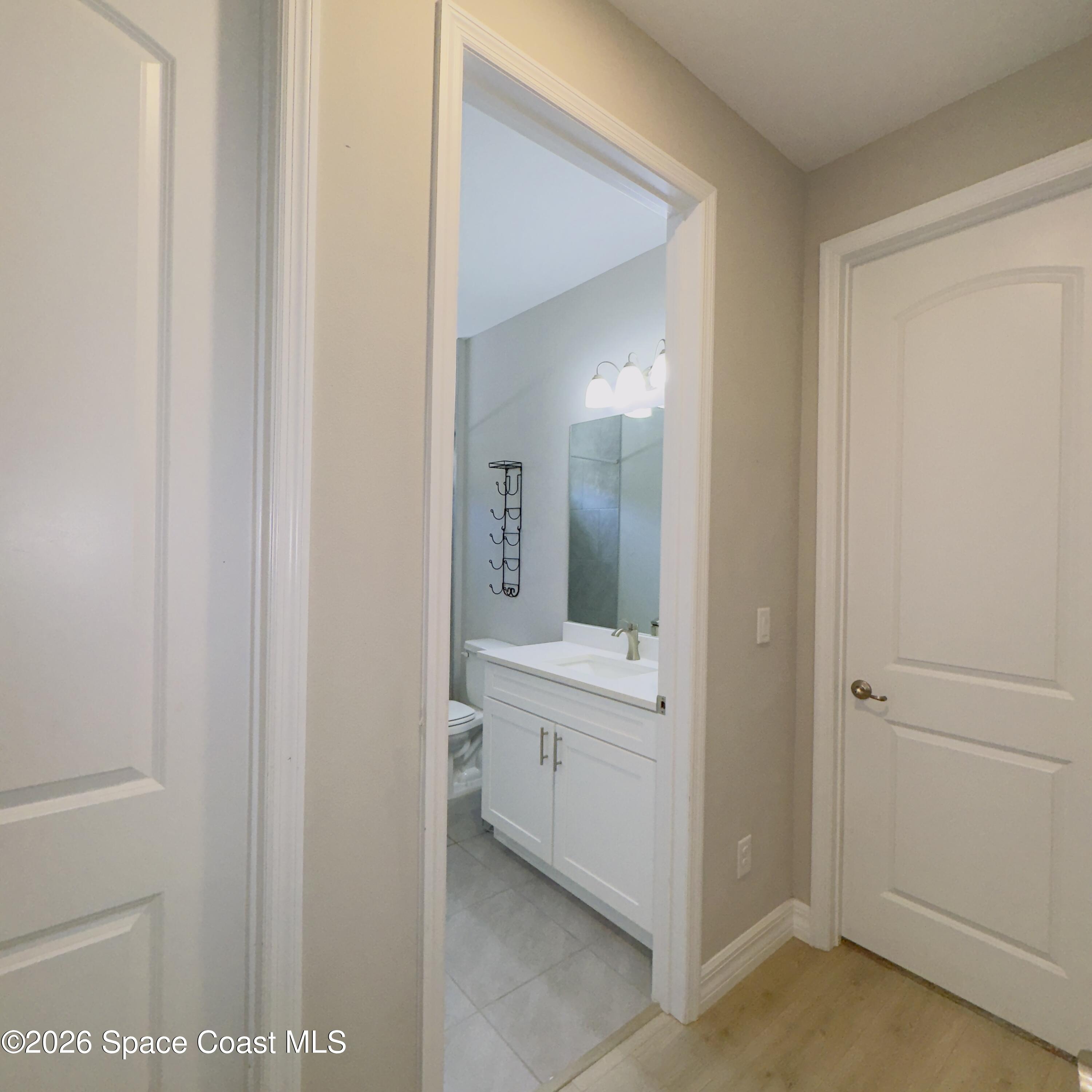 1376 Torgerson Road Southeast Palm Bay, FL 32909 - Photo 9 of 15 a view of a bathroom from the hallway