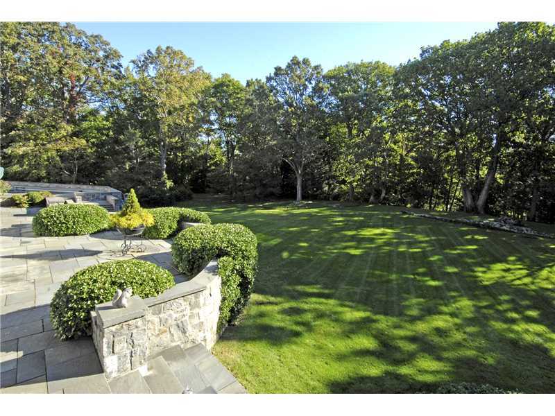22 Perkins Road Greenwich, CT 06830 - Photo 15 of 16 a view of a garden with lawn chairs