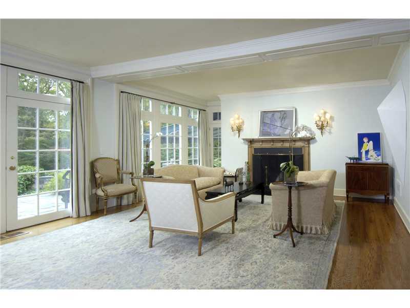 22 Perkins Road Greenwich, CT 06830 - Photo 3 of 16 a living room with furniture a fireplace and a large window